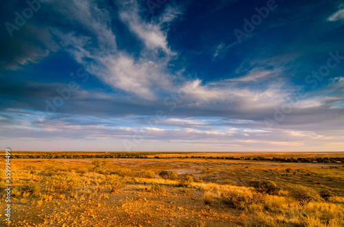 View of desert Channel Country from escarpment with cloud formation