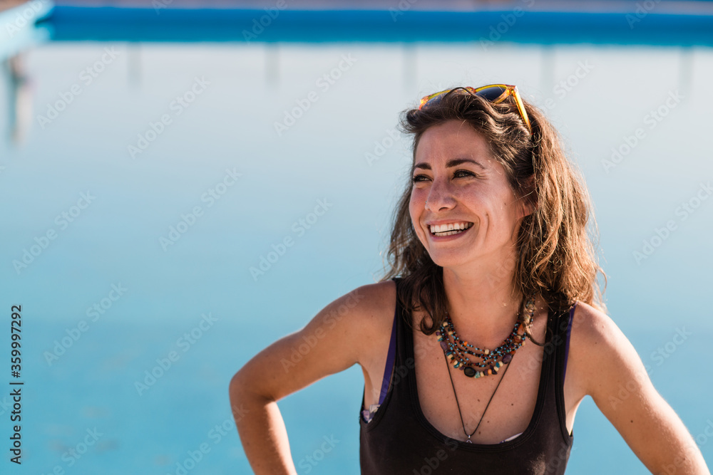 happy woman at ocean swimming pool happy woman at ocean swimming pool