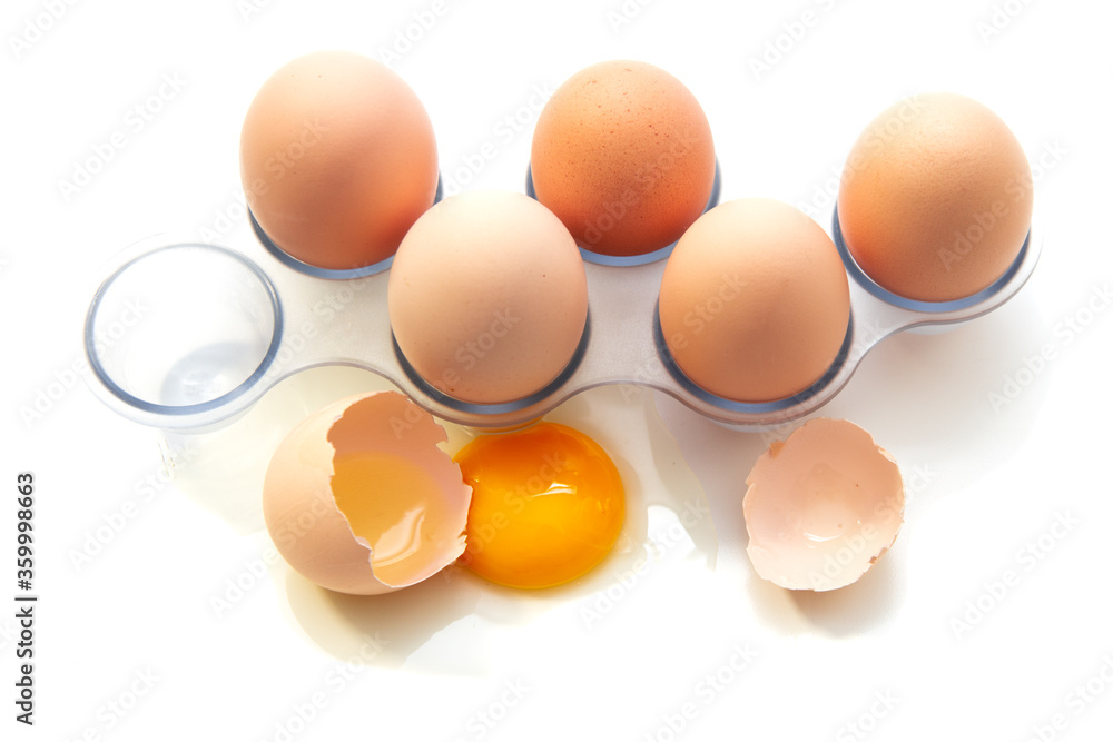 Fresh Eggs in the refrigerator tray. Six homemade eggs. White background. isolate. Fresh Eggs in the refrigerator tray. Six homemade eggs. White background. isolate.