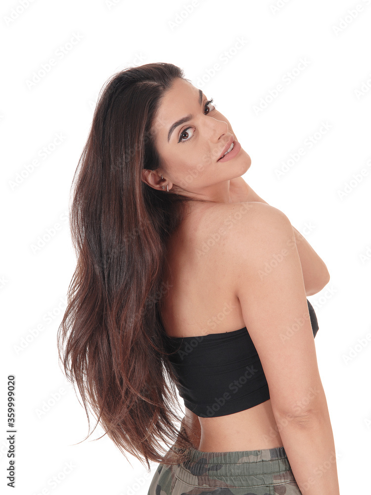 Obraz premium Beautiful happy young woman standing in profile