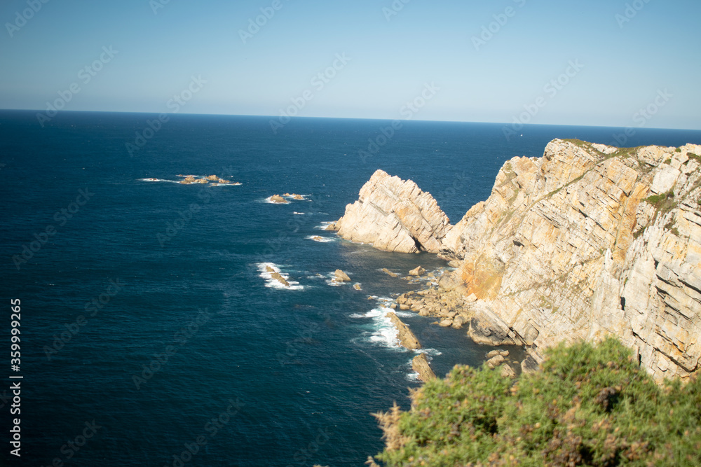 views on the cliff above the lighthouse of luanco views on the cliff above the lighthouse of luanco