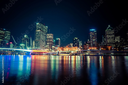 Wallpaper Mural Night view of Brisbane high rise buildings and coloured lights in water Torontodigital.ca