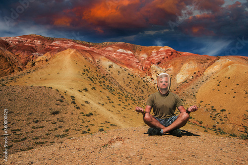 Man in mask on mars landsca...