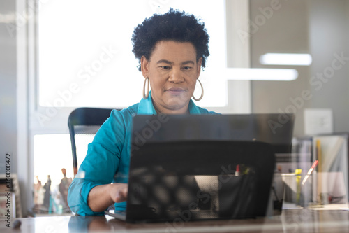 afro brazilian business woman alone in the modern office