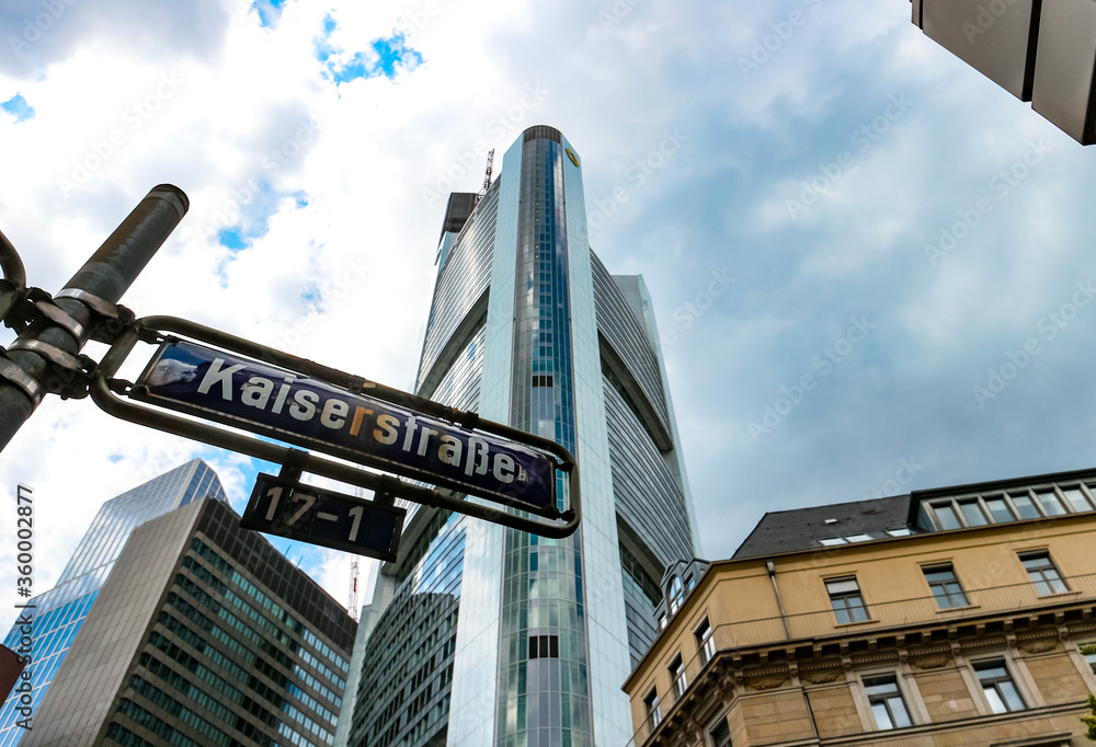 Naklejka premium Kaiserstraße street sign and Commerzbank tower by architect Norman Foster, tallest building in the European Union (2020). Frankfurt am Main, Hesse, Germany. 