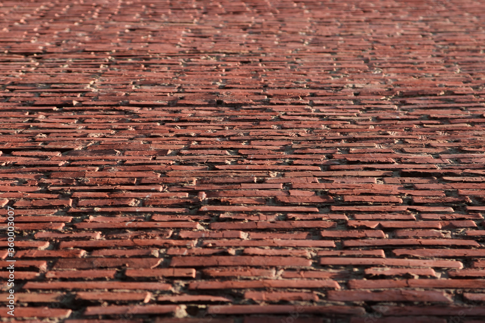 background from an old red brick wall in sunny weather background from an old red brick wall in sunny weather