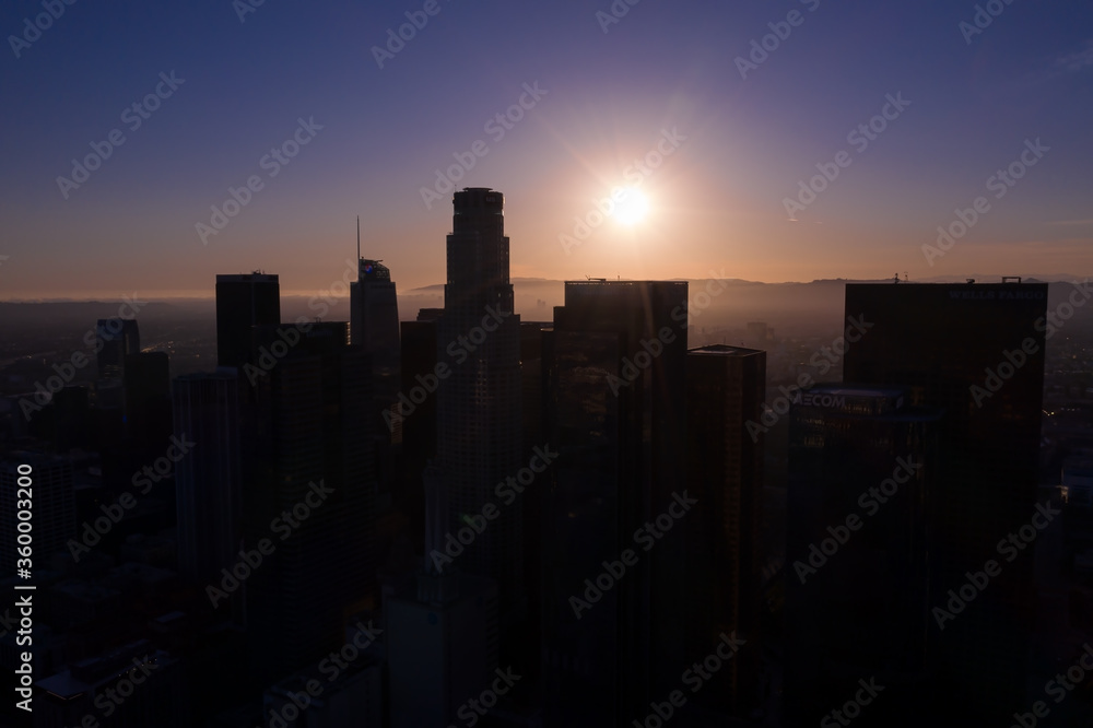 Los Angeles downtown silhouette against the sunset background in California