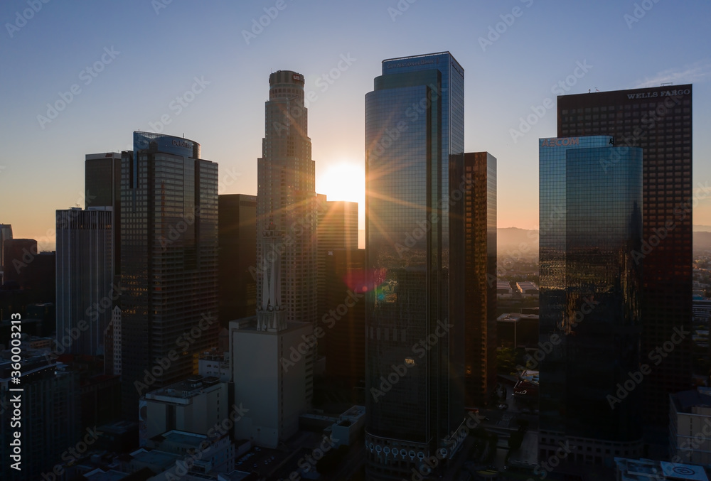 Aerial view of Los Angeles skyline silhouette during the last sun rays at the sunset