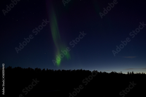 aurora borealis on blue autumn night sky