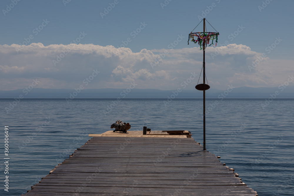 Pier against the background of the horizon of Lake Baikal
