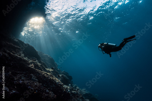 Scuba Girl Swimming into Sunlight photo