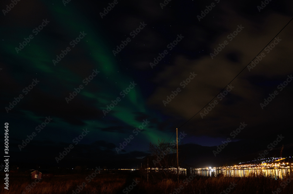 aurora borealis over settlement in late autumn aurora borealis over settlement in late autumn