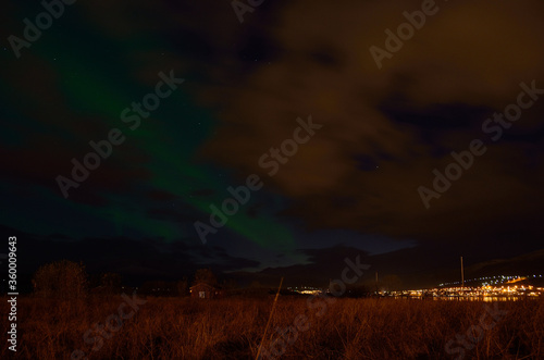 beautiful aurora borealis on the arctic night sky in late autumn
