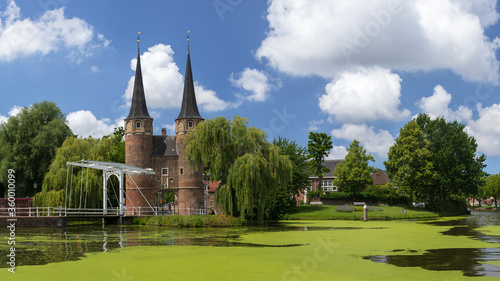 Panoramic view of the Delft tourist location East gate with drawbridge on a sunny day, Delft, The Netherlands
