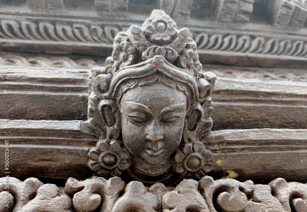 Wood carving of An ancient Hindu God in pashupatinath temple,Nepal Wood carving of An ancient Hindu God in pashupatinath temple,Nepal