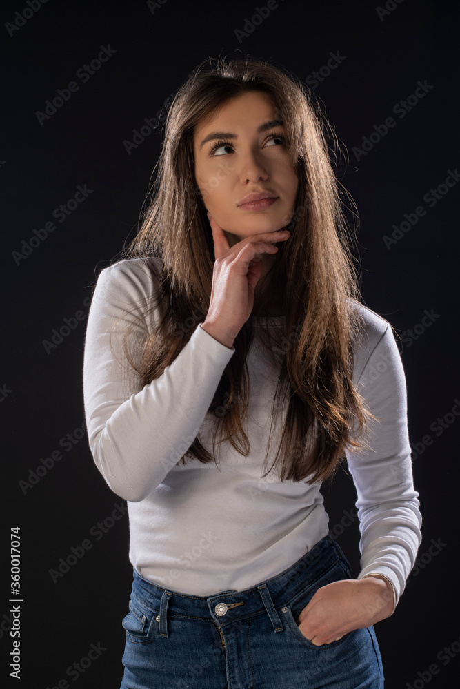 Girl thinking. Black background. Isolated Girl thinking. Black background. Isolated
