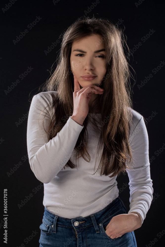 Angry girl posing on black background. Isolated Angry girl posing on black background. Isolated
