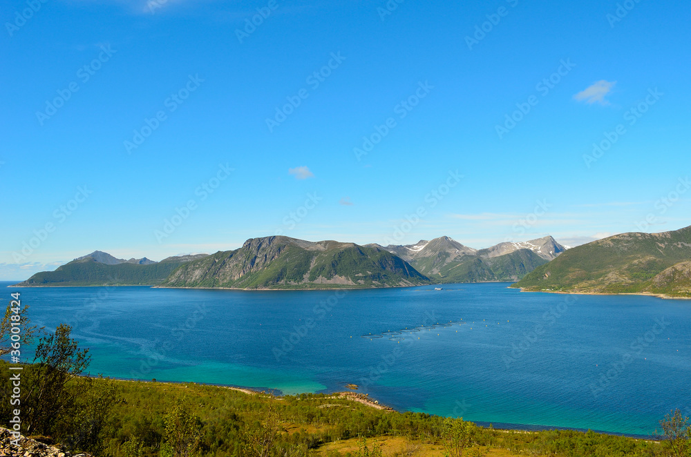 summer landscape with majestic mountanis and deep blue fjords