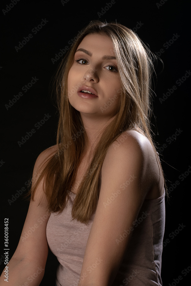 Beautiful girl posing on black background. Isolated, Face Expression Beautiful girl posing on black background. Isolated, Face Expression