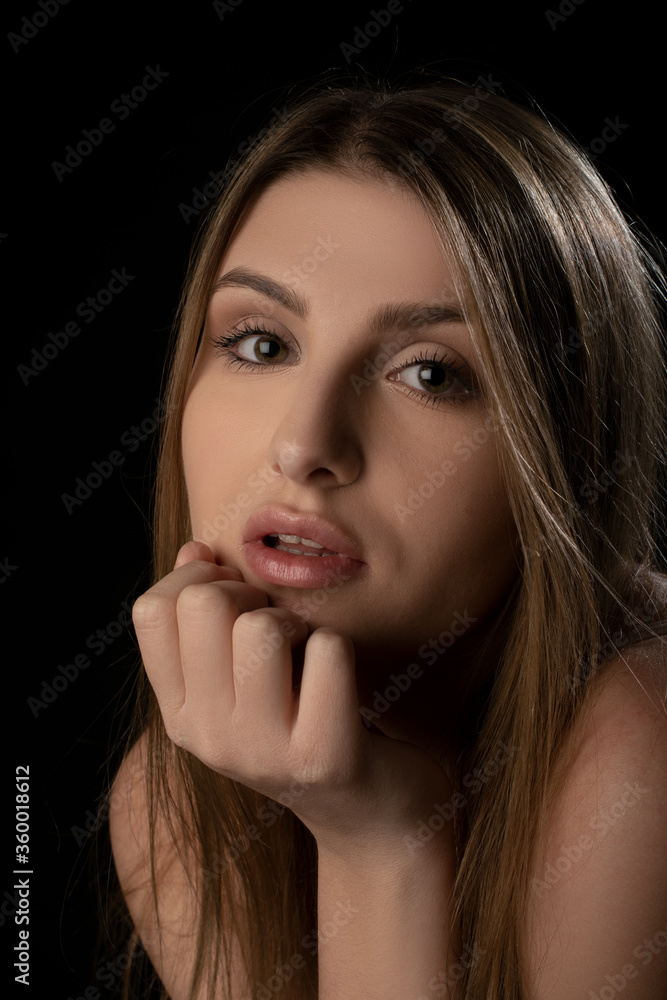 Beautiful girl posing on black background. Isolated, Face Expression Beautiful girl posing on black background. Isolated, Face Expression