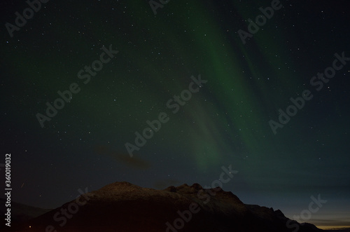 aurora borealis over autumn mountain © Arcticphotoworks