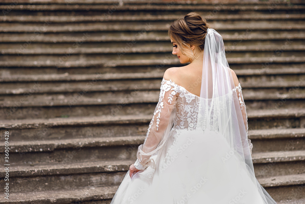 bride in a white wedding dress, back view, wedding day bride in a white wedding dress, back view, wedding day