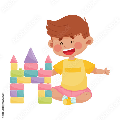 Cheerful Boy Sitting and Playing with Construction Toy Vector Illustration