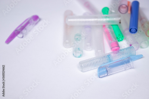 A pile of different pens and pen covers. stationery concept. copy space. isolated. High quality photo