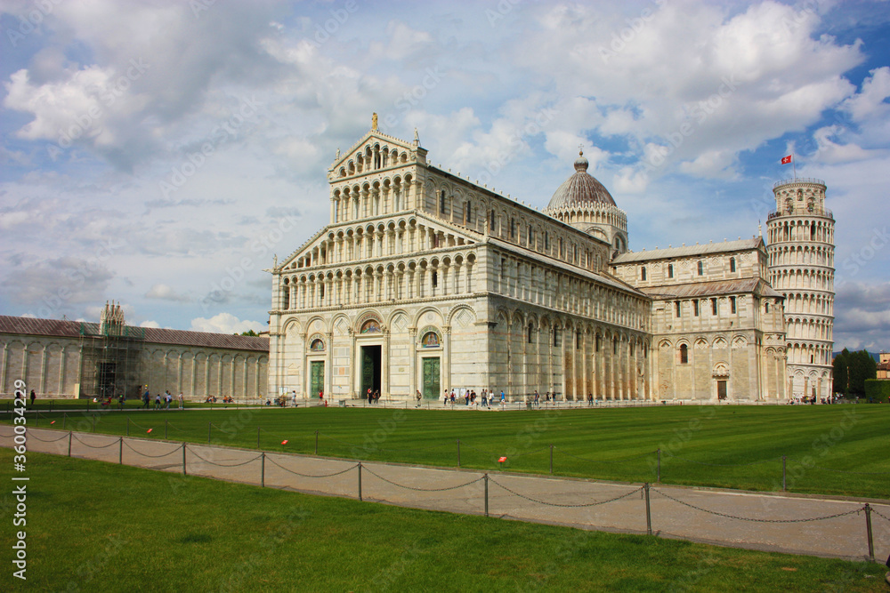 cathedral of the pisa tower on the grass of piazza dei miracoli