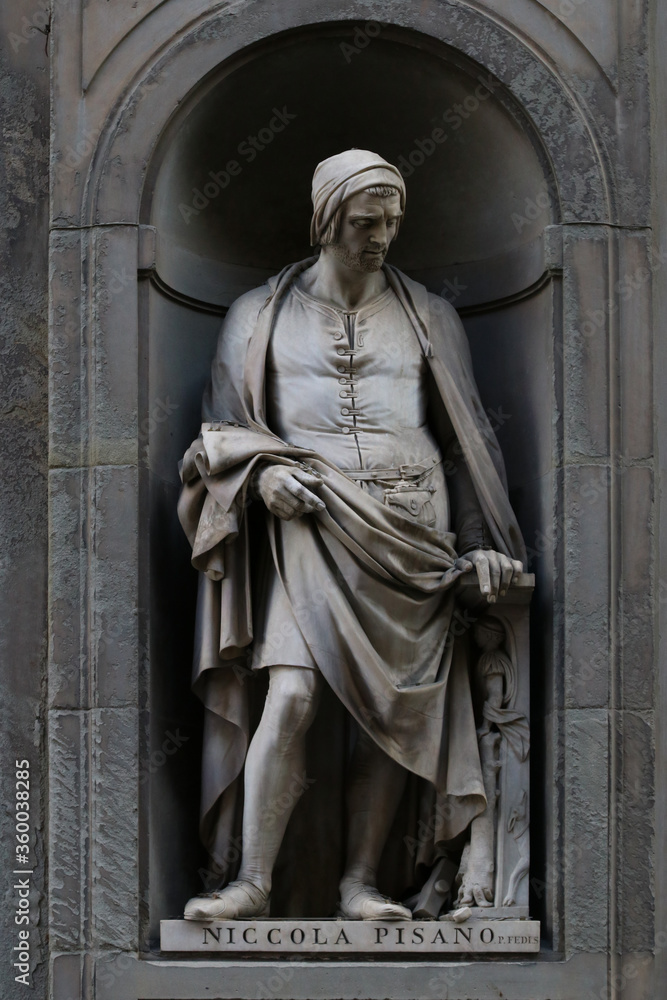 Statue of Nicola Pisano, italian famous sculptor, outdoor the Uffizi Museum building in Florence, Tuscany, Italy
