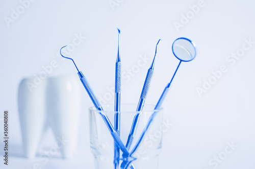 Dentistry tools for teeth dental care and treatment on white background. White dental tooth model. © Inna Dodor