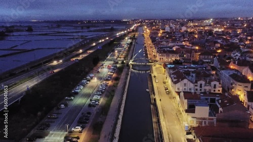 Aerial view at night  of canal and houses in  Aveiro, the Venice of Portugal. Drone  Footage