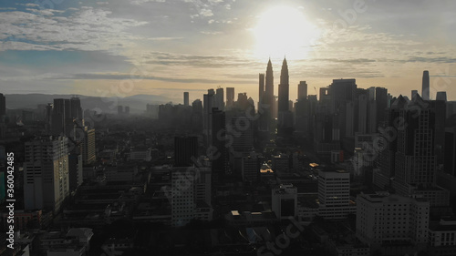 Photography Aerial view of the silhouette of skyscrapers and the city center of Kuala Lumpur
