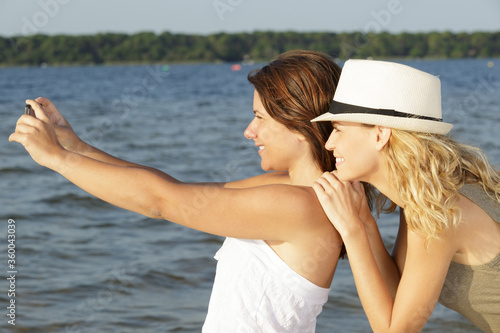 woment taking selfie in a lake