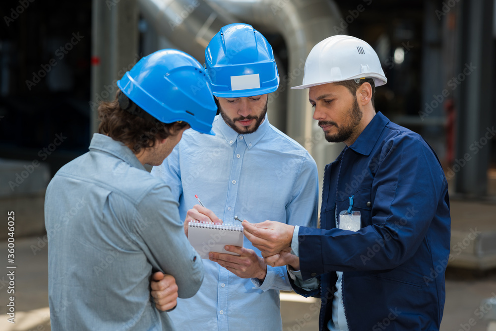 supervisor and manual workers discussing in industry supervisor and manual workers discussing in industry