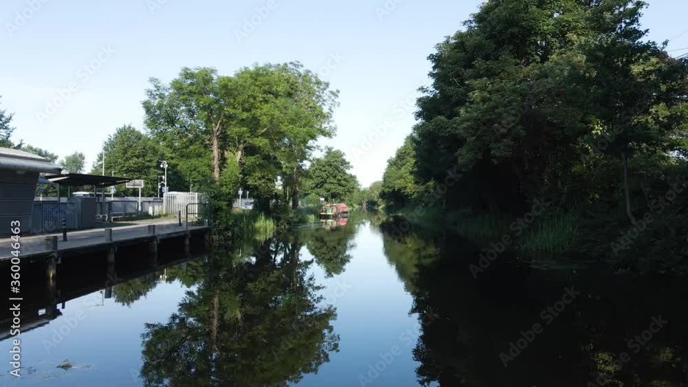 Lush Trees At The Royal Canal Banks In Dublin, Ireland On A Bright Weather - dolly drone shot Lush Trees At The Royal Canal Banks In Dublin, Ireland On A Bright Weather - dolly drone shot