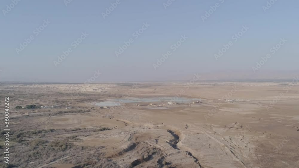 Aerial view over Negev desert of Israel. Dry country desert In South Israel. Low altitude flying shot Aerial view over Negev desert of Israel. Dry country desert In South Israel. Low altitude flying shot