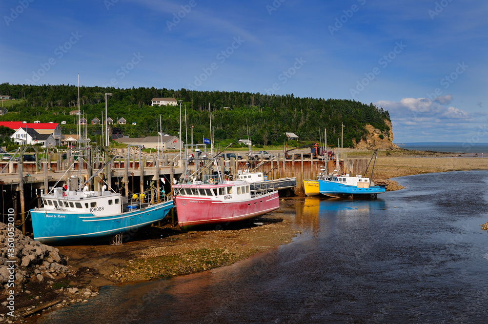 Upper Salmon River and fishing boats at low tide on the Bay of Fundy at Alma New Brunswick