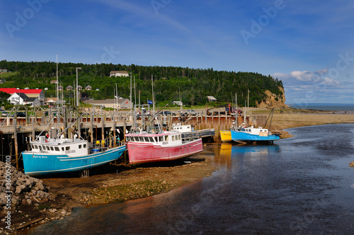 Upper Salmon River and fishing boats at low tide on the Bay of Fundy at Alma New Brunswick