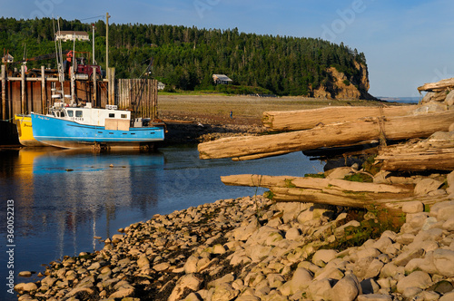 Old dock and Owls Head cliff at sunset on the Bay of Fundy Alma New Brunswick photo