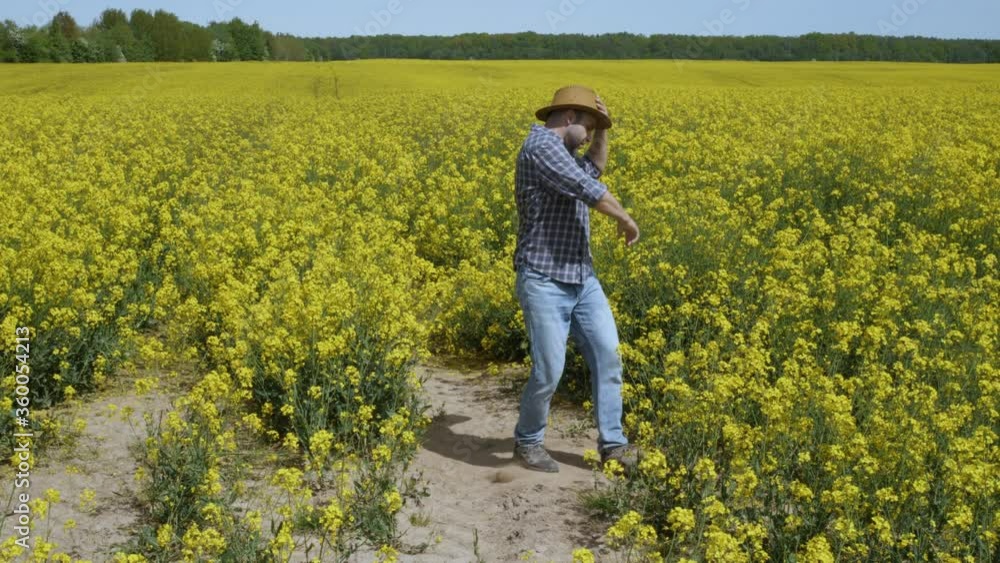 Happy Man Farmer Dancing Enjoying at Rape Blossom On Field. Fun Celebrating Funny Viral Dance Freedom. Guy Enjoying Dance. Joyful Man Farmer Dancing. Slow Motion. Flowering Rapeseed Field Blue Sky. Happy Man Farmer Dancing Enjoying at Rape Blossom On Field. Fun Celebrating Funny Viral Dance Freedom. Guy Enjoying Dance. Joyful Man Farmer Dancing. Slow Motion. Flowering Rapeseed Field Blue Sky.