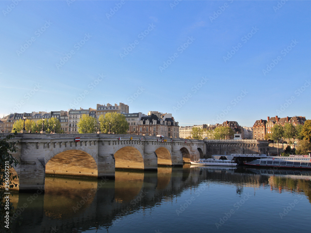 Fototapeta premium Sunrise over river Seine in Paris, France, with Pont Neuf. Colourful travel background. Romantic cityscape.