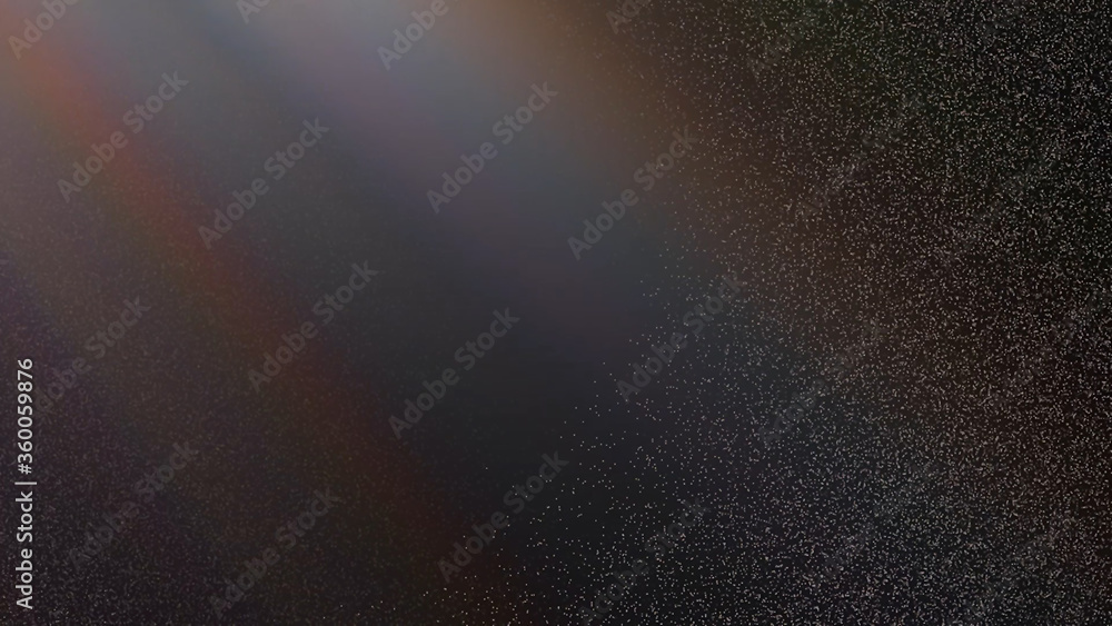 Abstract dark background with light rays and particles