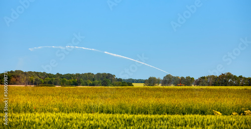 Wallpaper Mural Landscape in the agricultural region of the heart of France, Beauce, with an irrigation system in operation. Torontodigital.ca