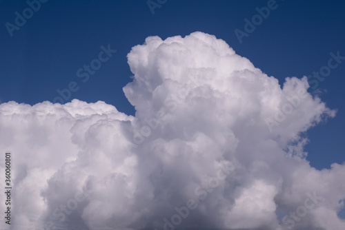 White clouds on a background of saturated blue sky