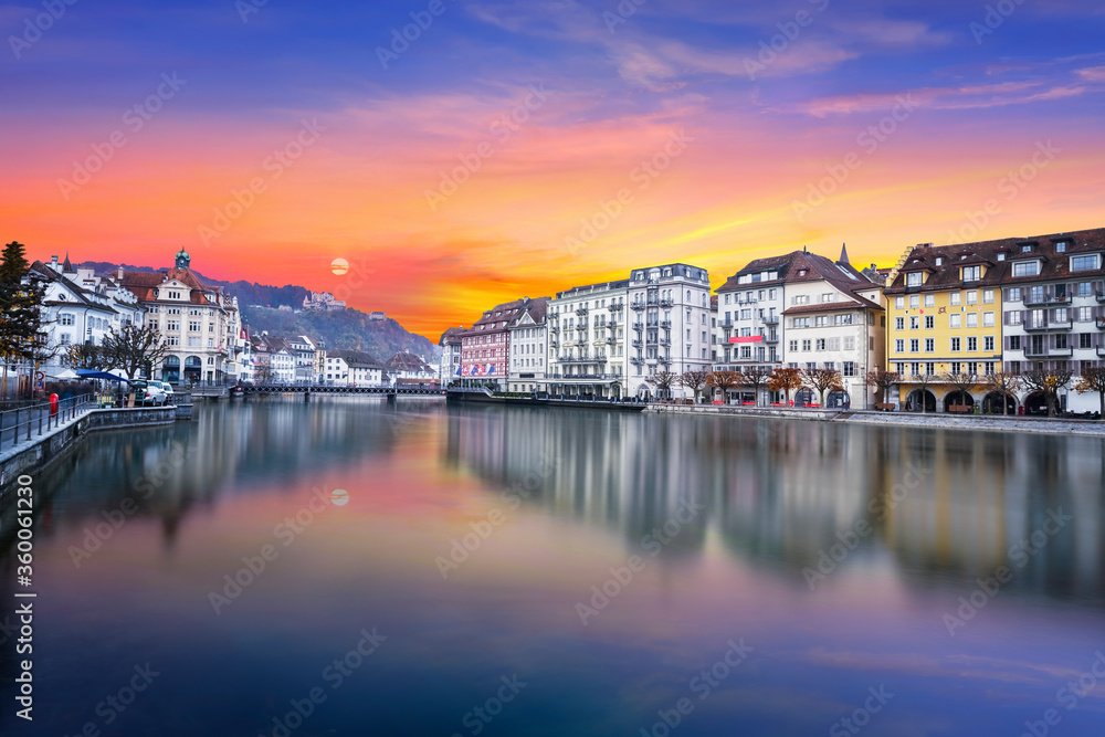 River Reuss side swiss city of Lucerne and twilight sunset