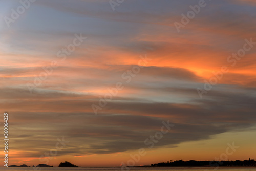 Amazing sunrise with wispy clouds with beautiful colours, make a good background or overlay for illustrator or photo editor..