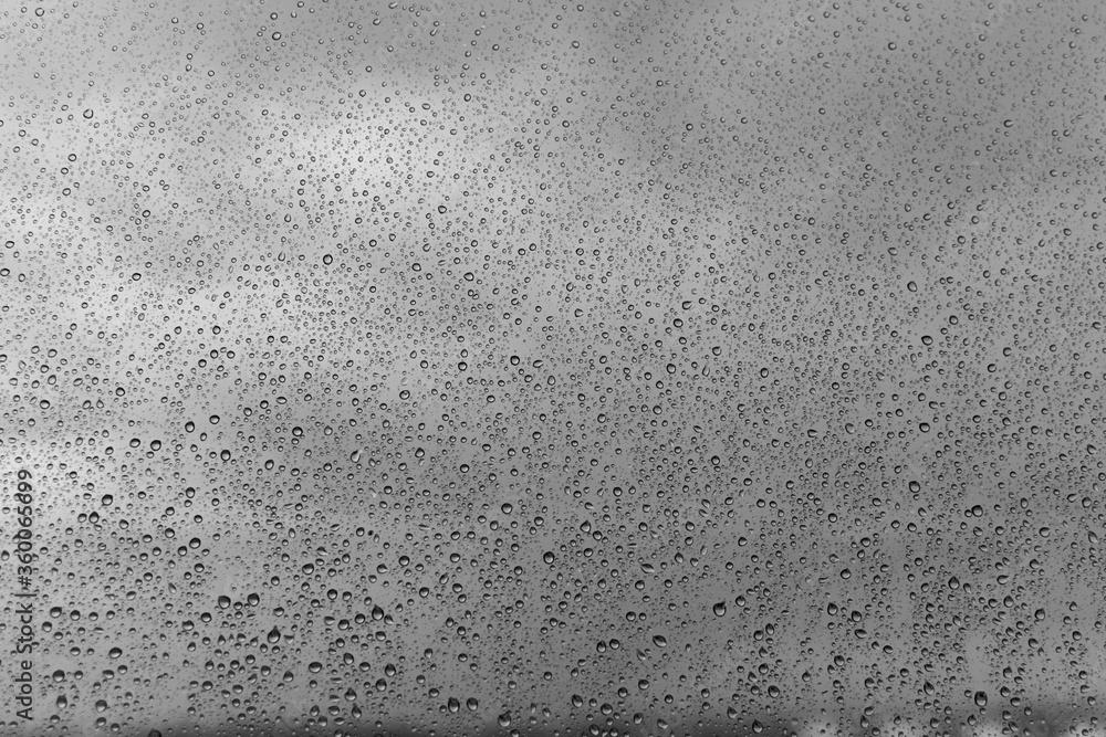 grey glass with raindrops background