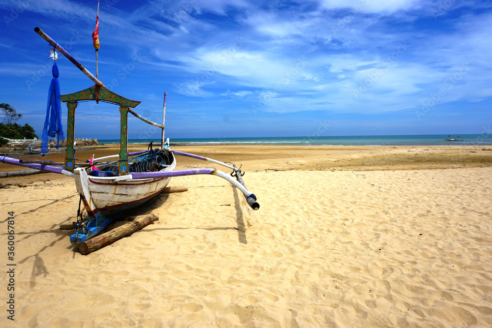 Sailboat on the sand, sailboat lie on the beach waiting for a sailor. Sailboat on the sand, sailboat lie on the beach waiting for a sailor.