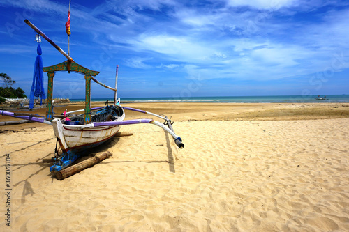 Sailboat on the sand, sailboat lie on the beach waiting for a sailor. 